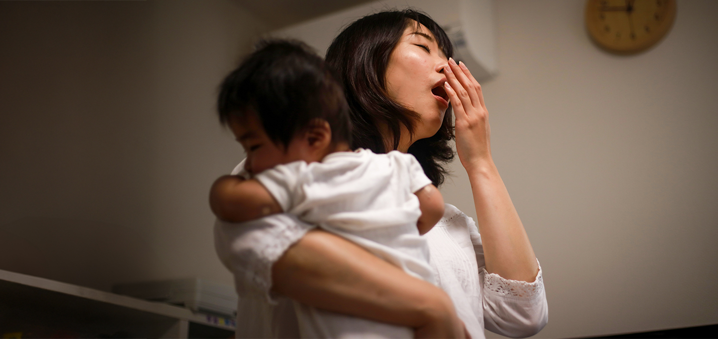 Mother yawning in the middle of the night