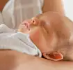 Baby sleeping in the arms