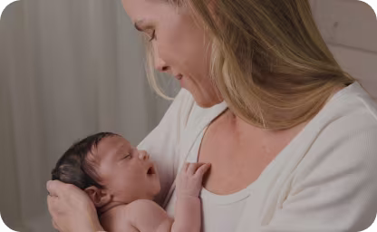 Mom holding newborn in her arms