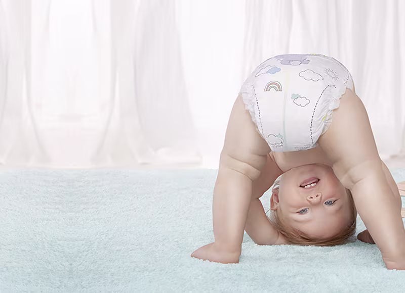 Pack of Pampers Premium Protection in a baby room