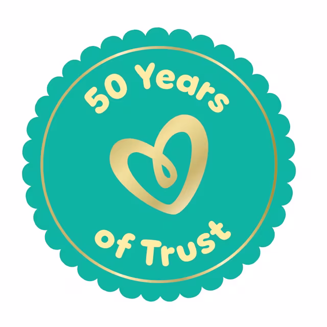 Dark teal blue icon with ‘50 years of trust’ written in golden color