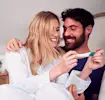 A couple looking at a pregnancy test