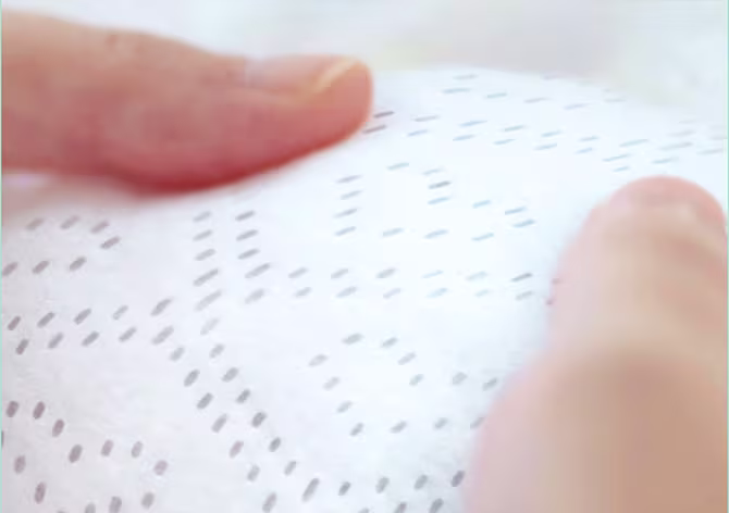 Soft absorbent top layer