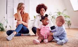 Baby boy and baby girl playing