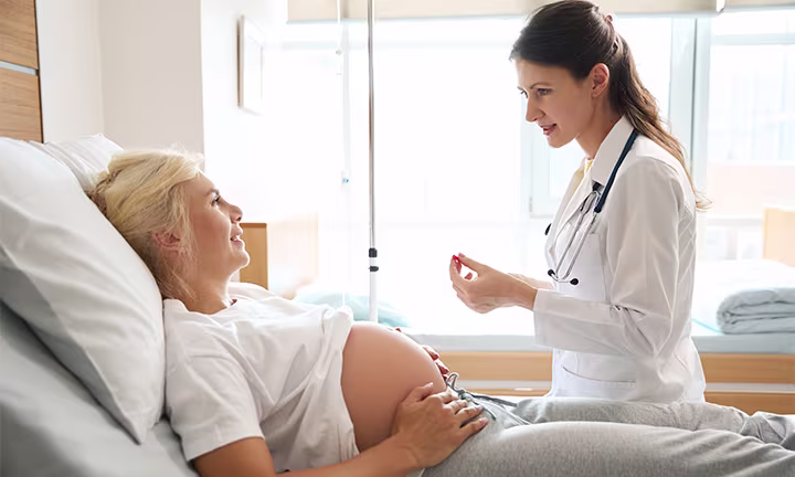 expecting parents checking ultrasound with doctor