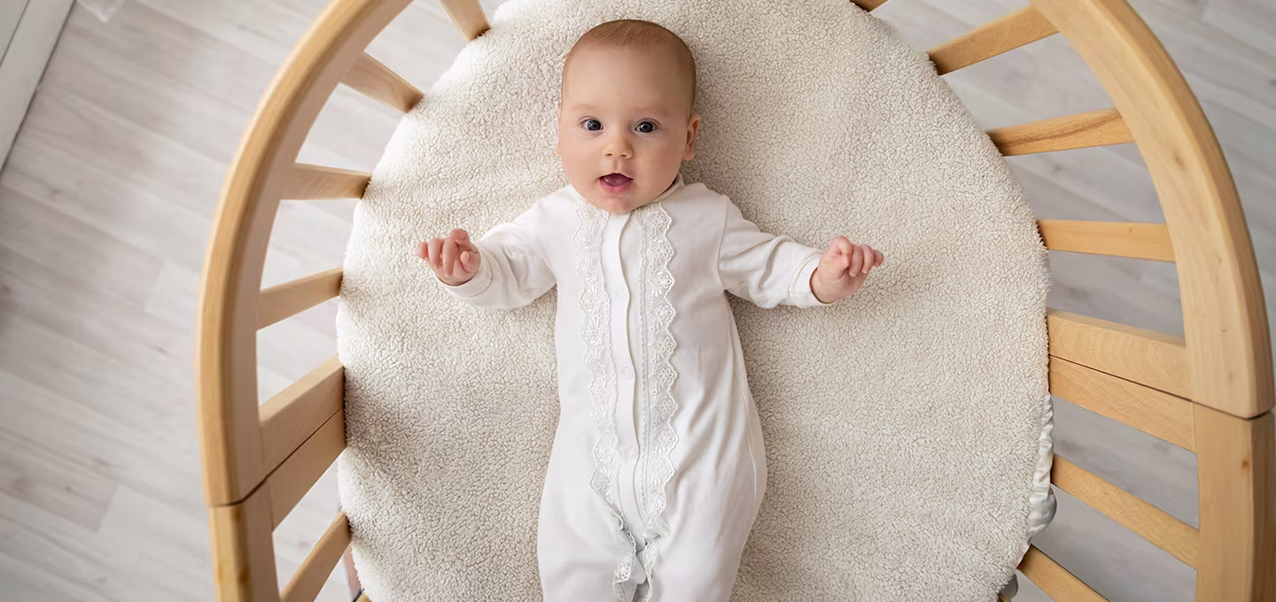 Baby lying in a basinet