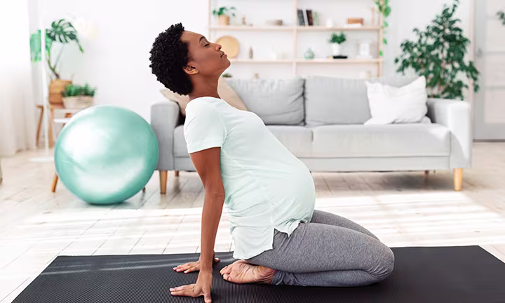 Pregnant woman stretching.