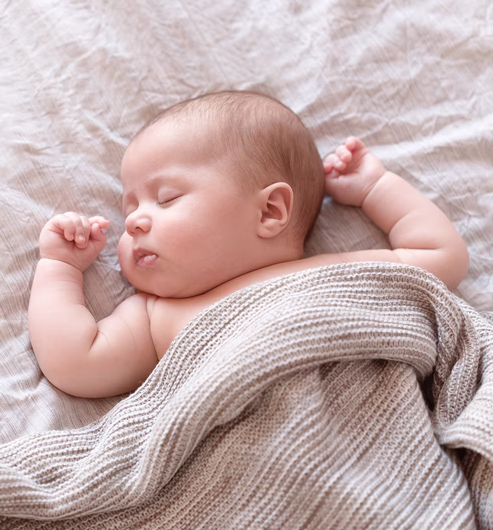 Baby sleeping with blanket