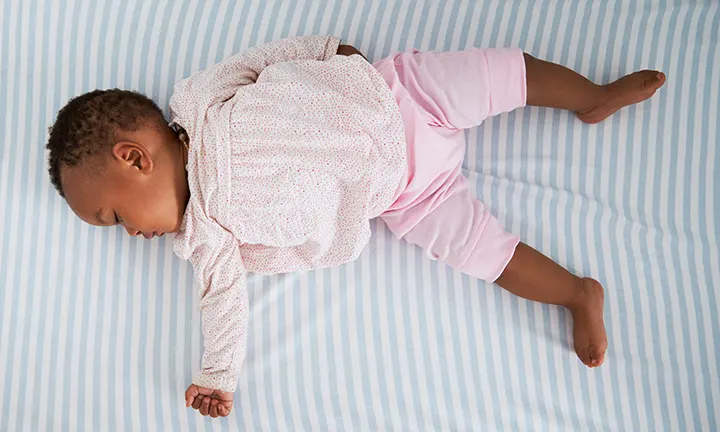  Baby Sleeping Safely in a Cot 