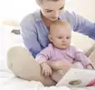 Mom reading to her baby