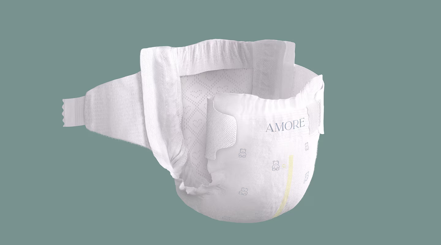 Pampers AMORE diaper on sage green background with one side open showing the inside of the diaper