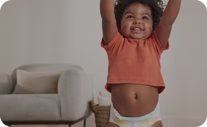Baby smiling reaching hands upwards
