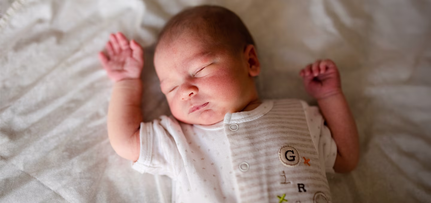 Baby sleeping quietly in a crib 