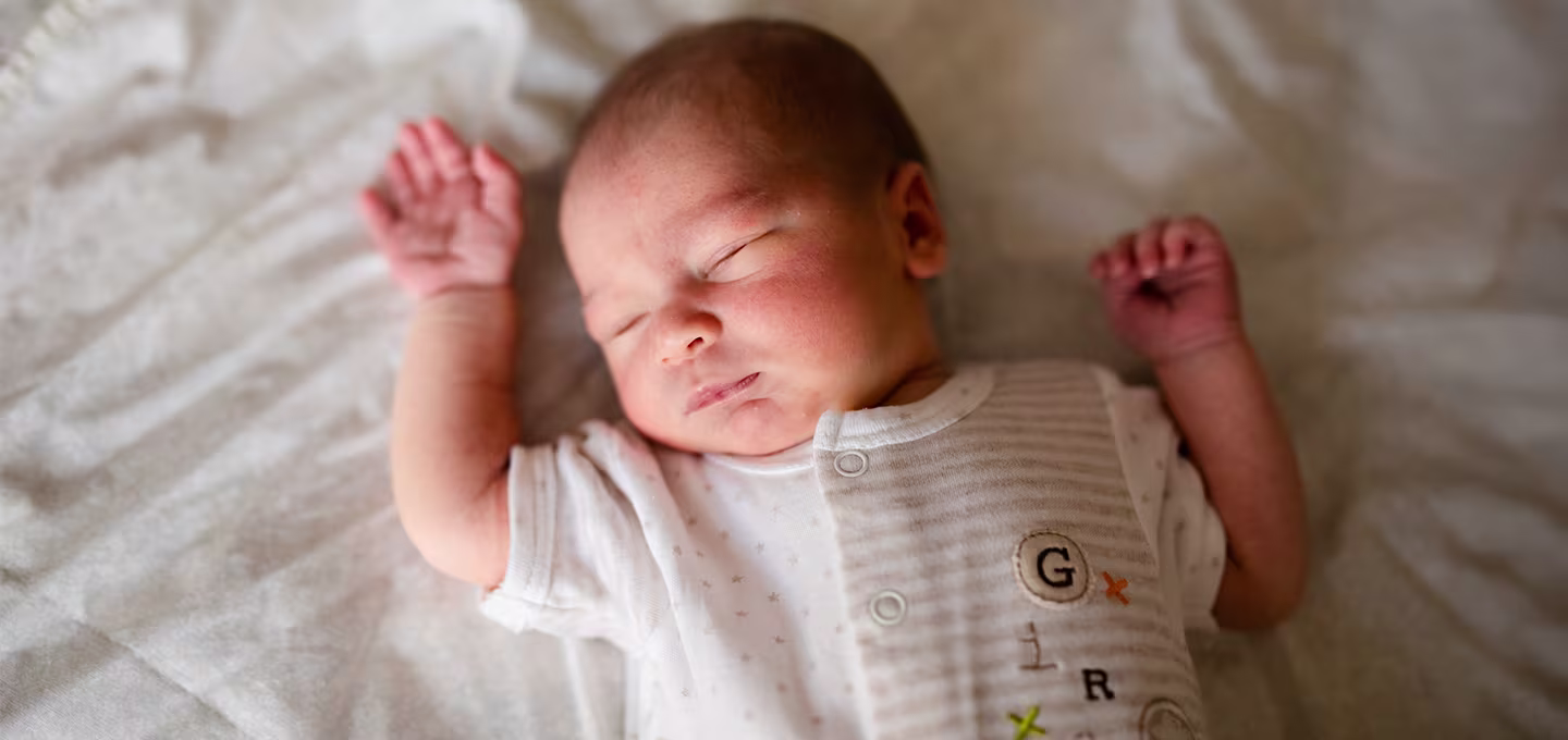 Baby sleeping quietly in a crib 