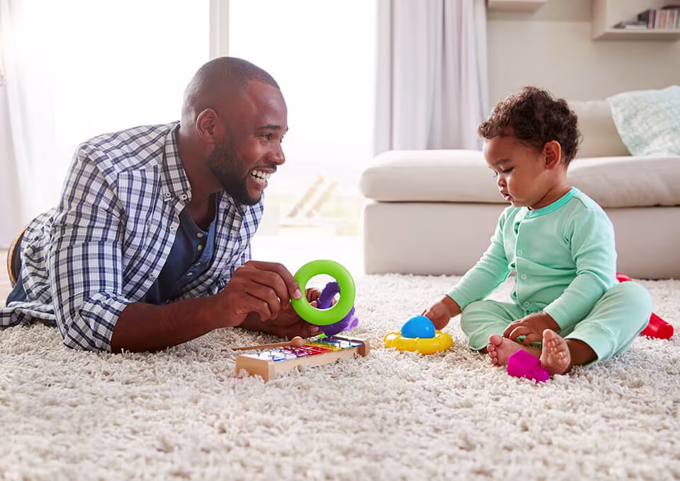 Dad playing with baby girl