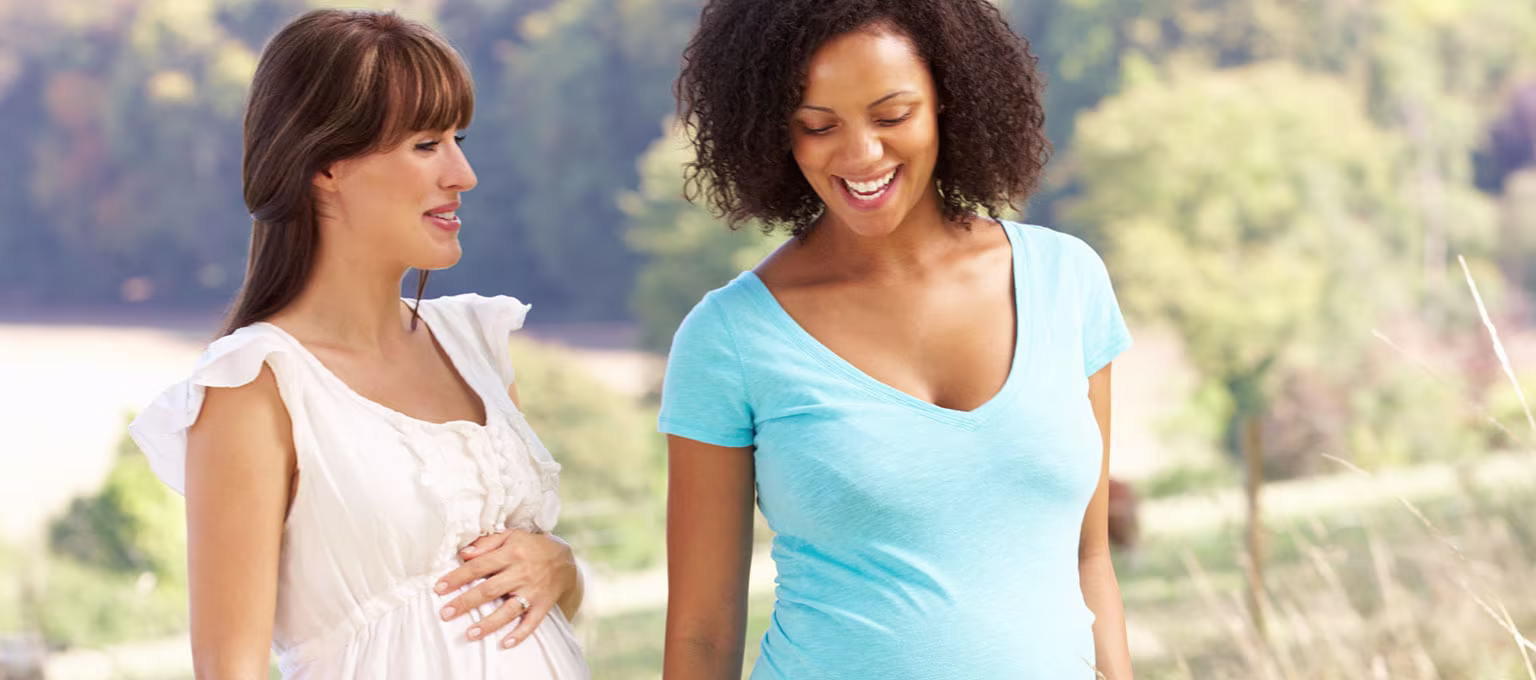 Two pregnant friends going for a walk