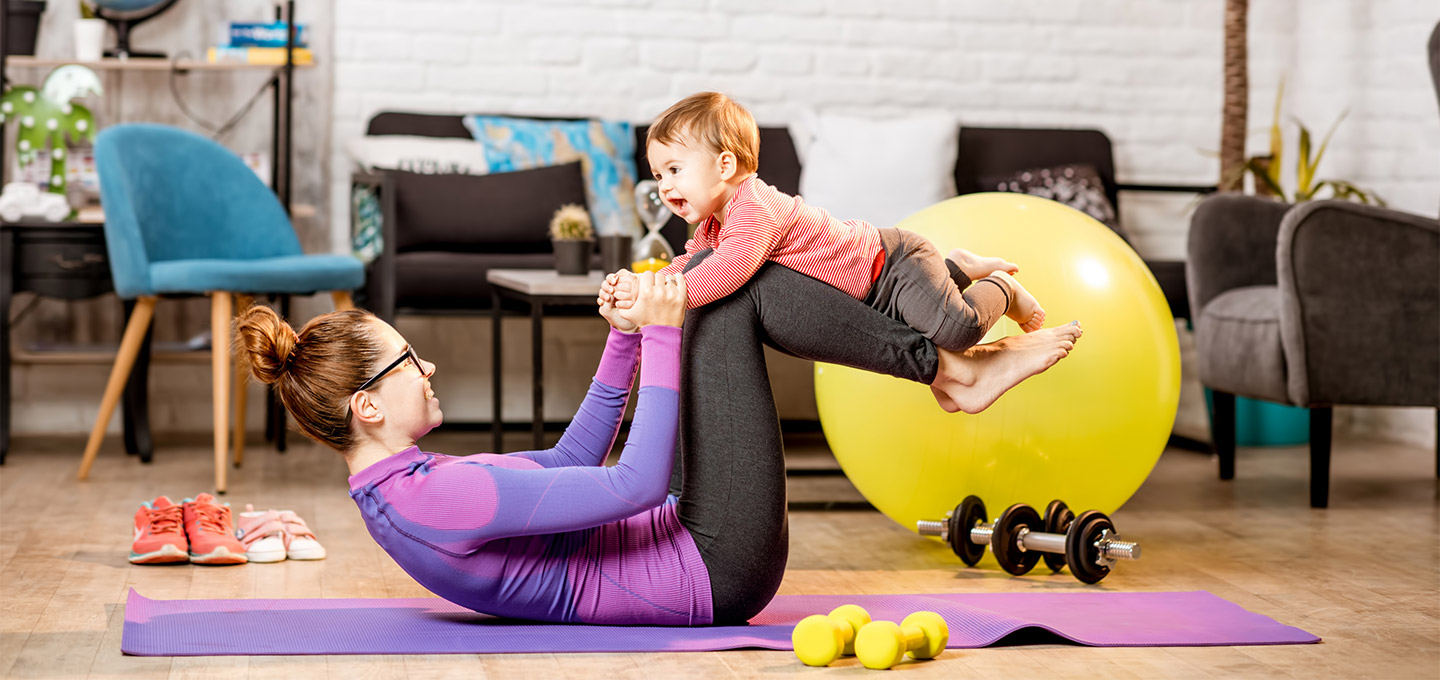 A woman exercising with her baby