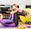 A woman exercising with her baby