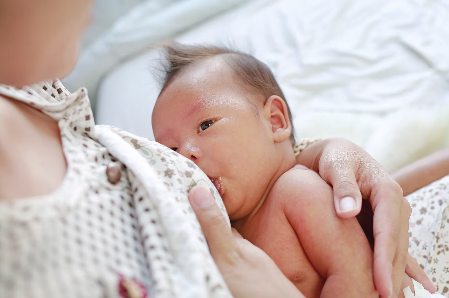 Mom breastfeeding her infant.