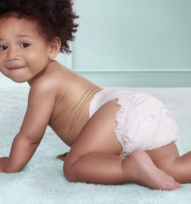 Baby crawling wearing Pampers Premium Protection Baby crawling wearing Pampers Premium Protection