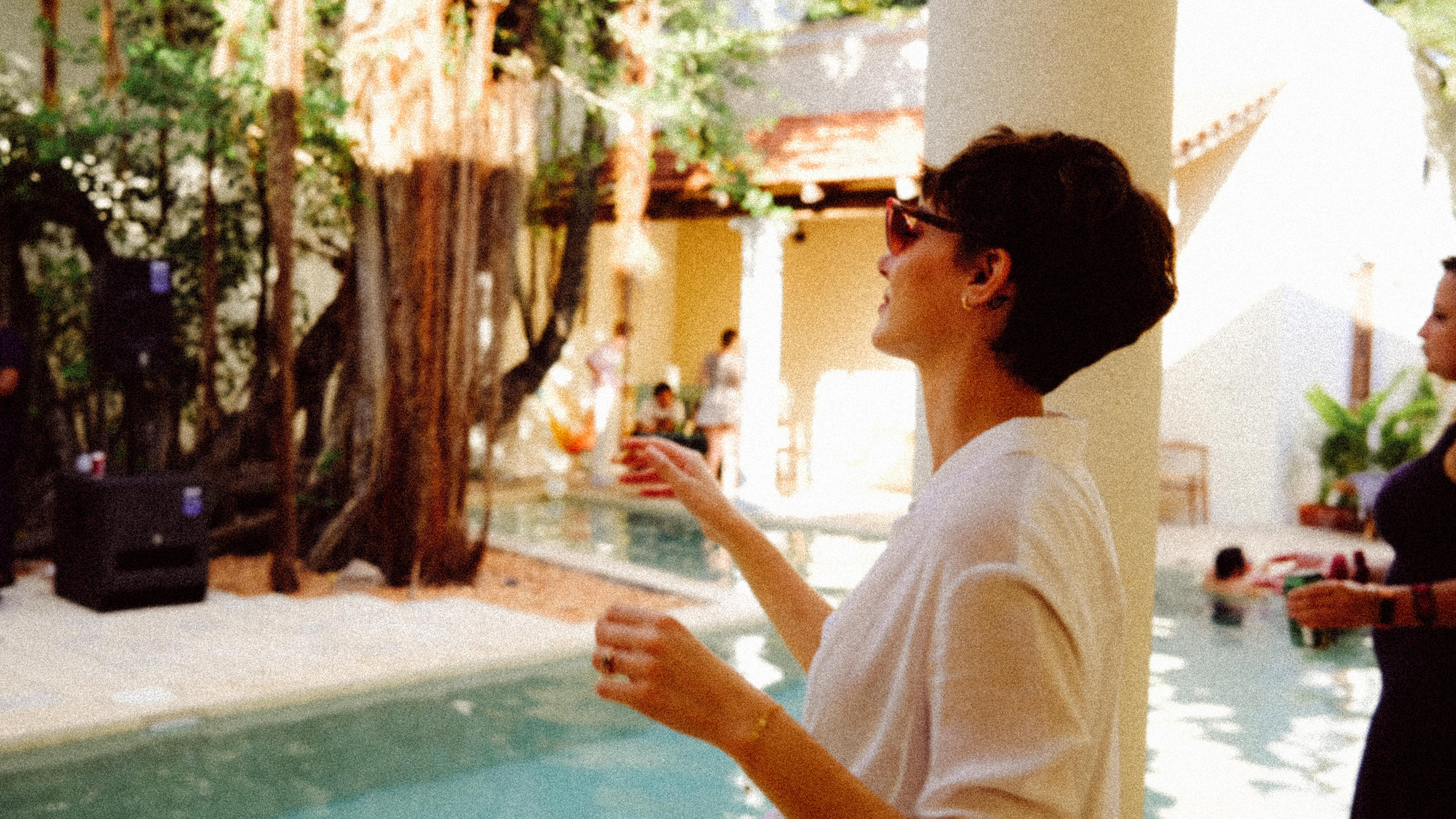 People gathered by atrium pool