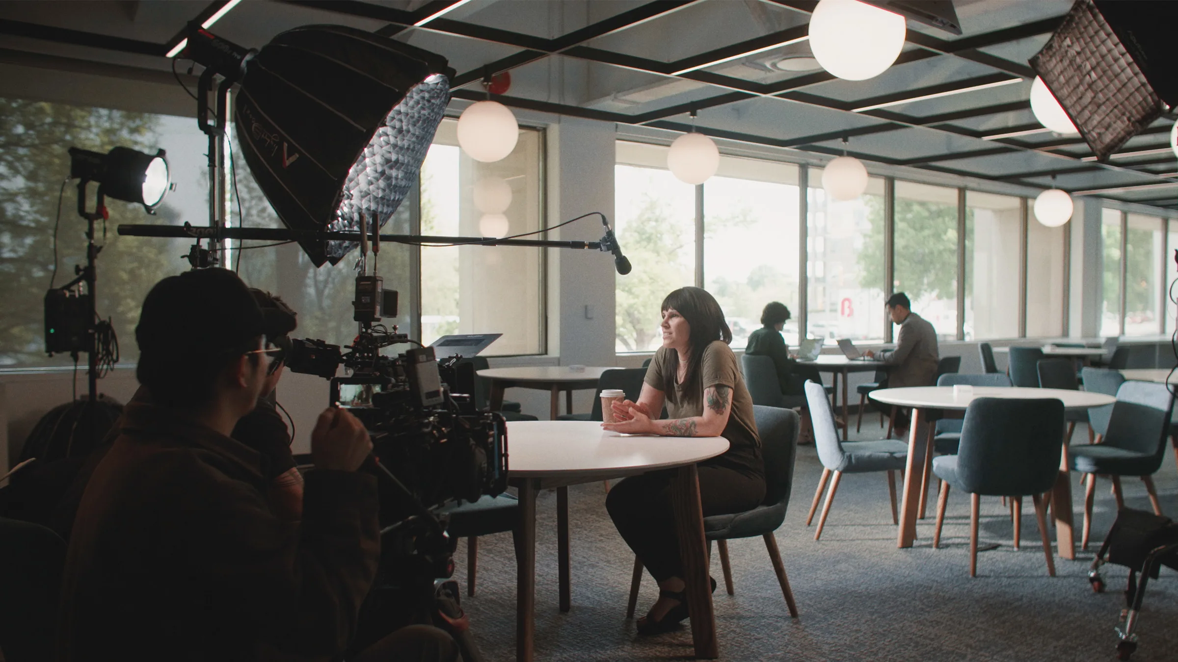 Behind the scenes of an Equitable team member mid-answer during a Moments Matter interview in the head office
