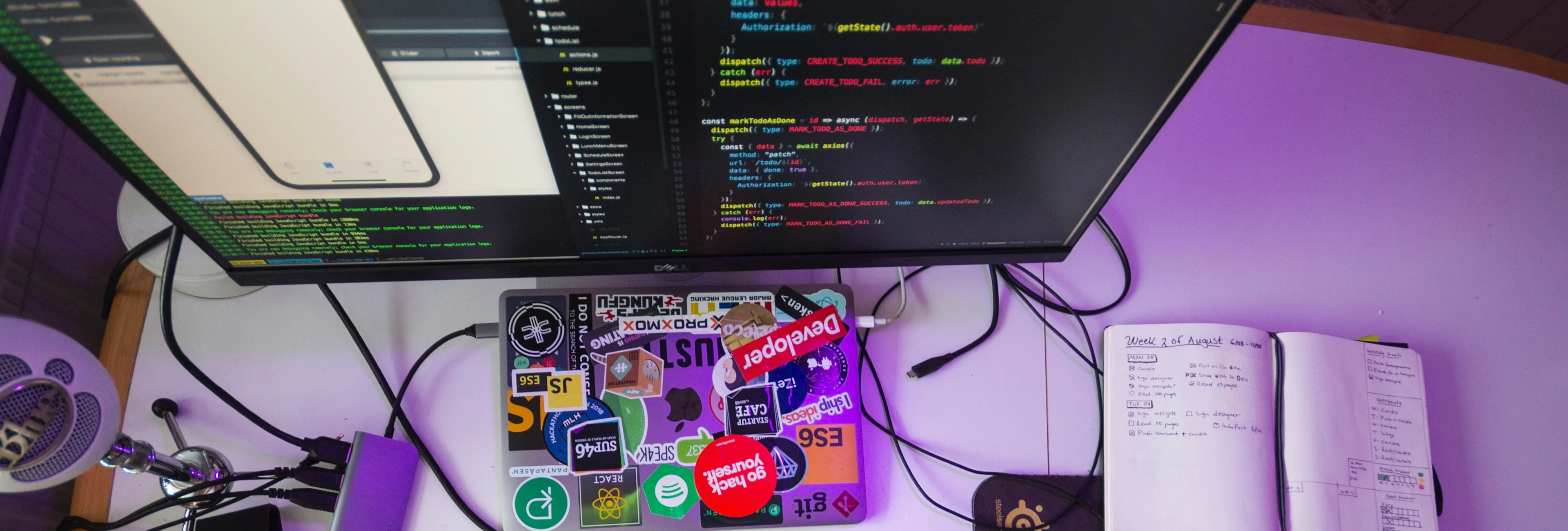 Desk shot of developer's workstation writing react native code