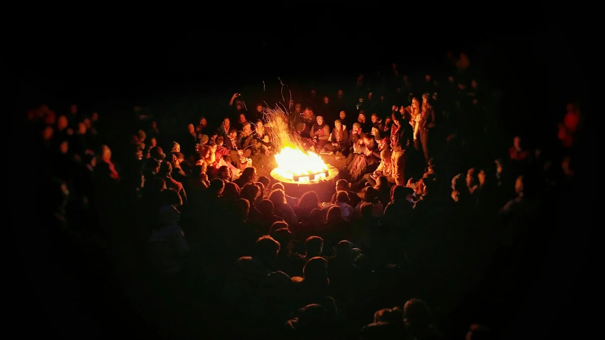 scouts sit around a campfire for warmth and friendship.