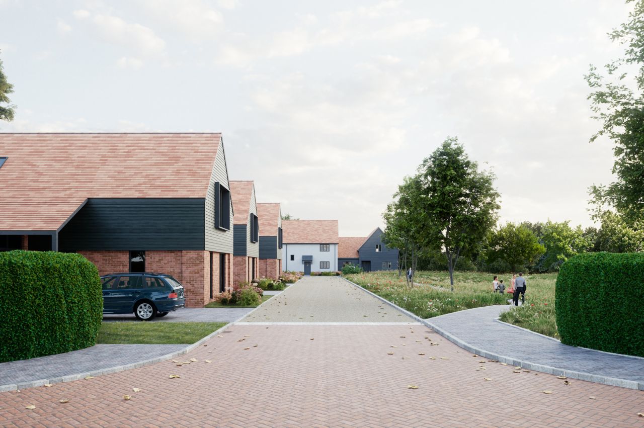A rendered residential development with brick and dark-clad homes, a paved road, parked car, green hedges, trees, and people walking.