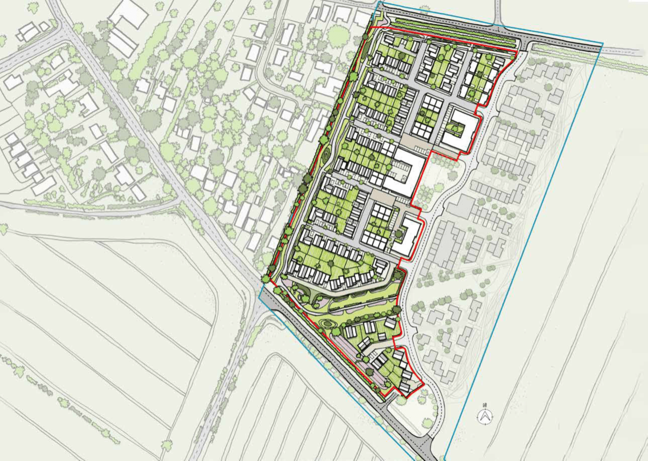 Aerial site plan showing a residential development with buildings, green spaces, and roads outlined in red and blue boundary lines.