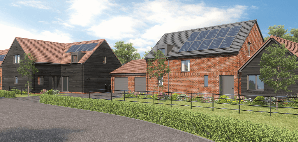 Modern residential homes with solar panels, red brick and dark wood exteriors, green hedges, black fence, under a blue sky.