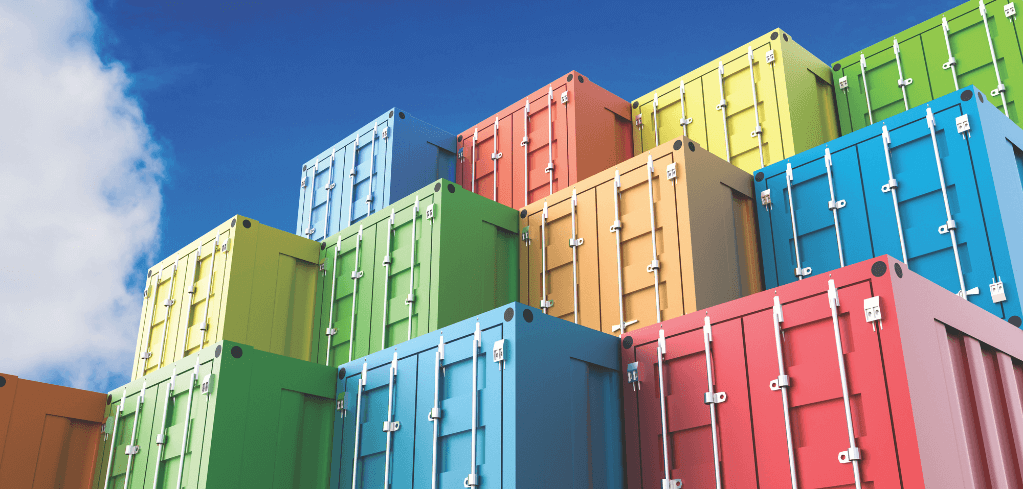 Colorful shipping containers stacked in various heights against a blue sky, featuring red, blue, green, and yellow units.