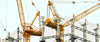 A large-scale residential development under construction, showcasing structural frameworks and tower cranes in operation. The image reflects a focus on purpose-built living, long-term investment and high-quality delivery. 