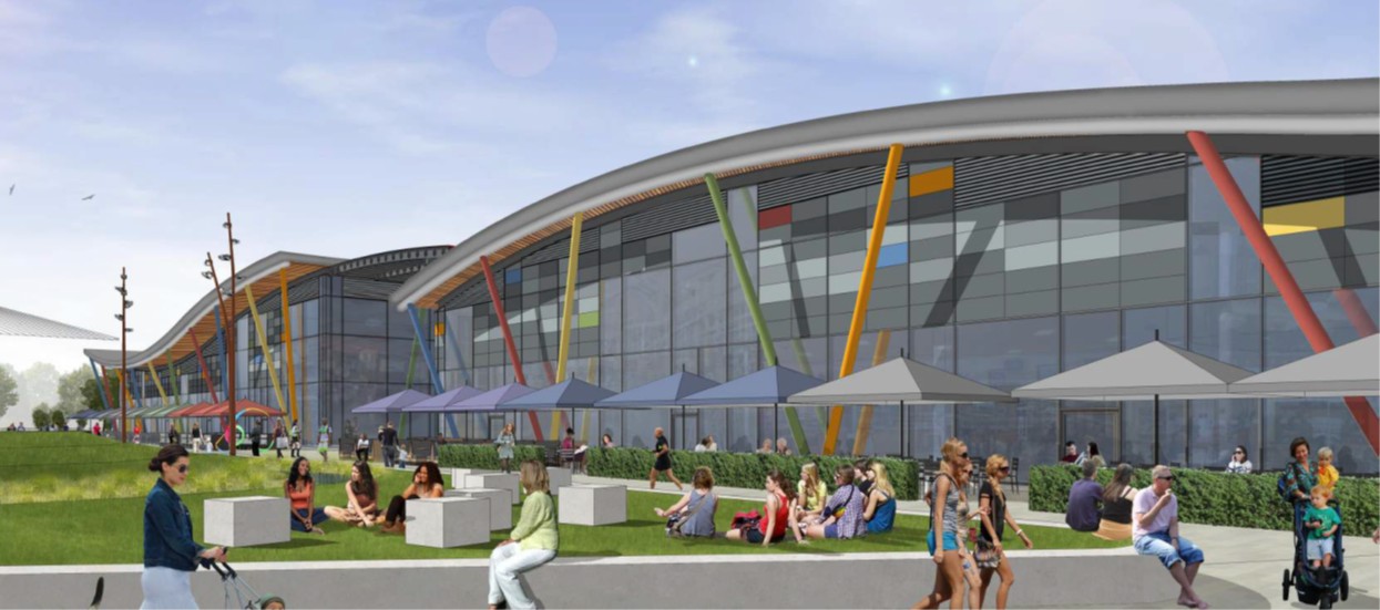 Architectural rendering of a modern building with colorful columns, people relaxing on grass outside under a blue sky.