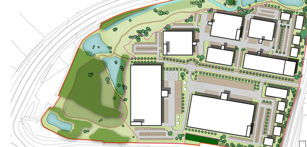 Aerial site plan showing building layouts with white structures, parking areas, and green spaces including small ponds and trees.