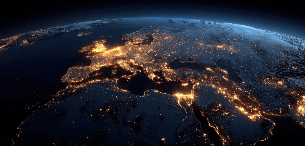 Satellite view of Europe and parts of Middle East at night, showing city lights glowing against Earth's dark surface.