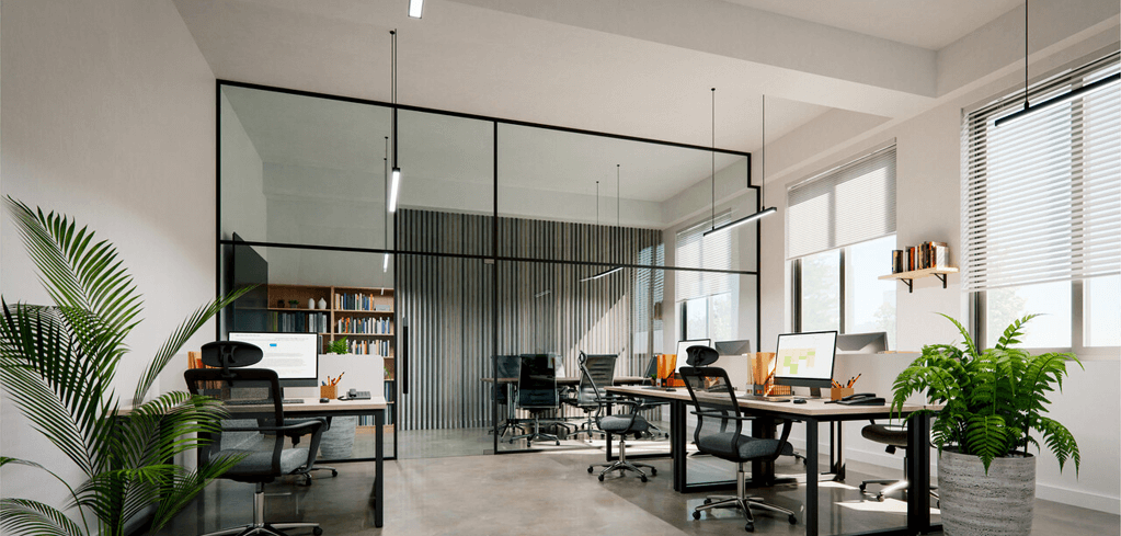 Modern office space with glass partitions, workstations with computers, ergonomic chairs, and potted plants by large windows.