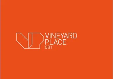 Vineyard Place logo with "VP" initials and "CB1" text on a bright orange background.