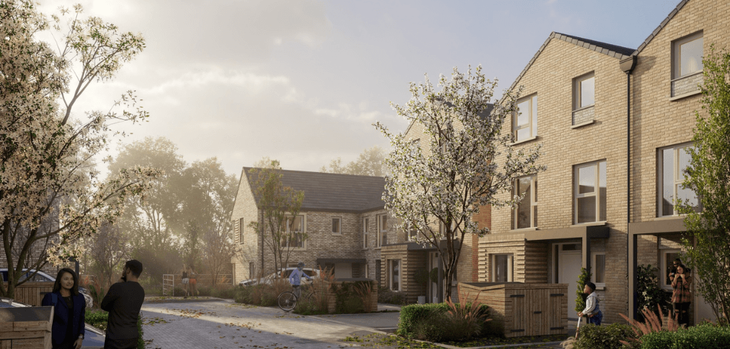 A residential street with modern brick townhouses, blooming trees, and people walking on a quiet neighborhood road.