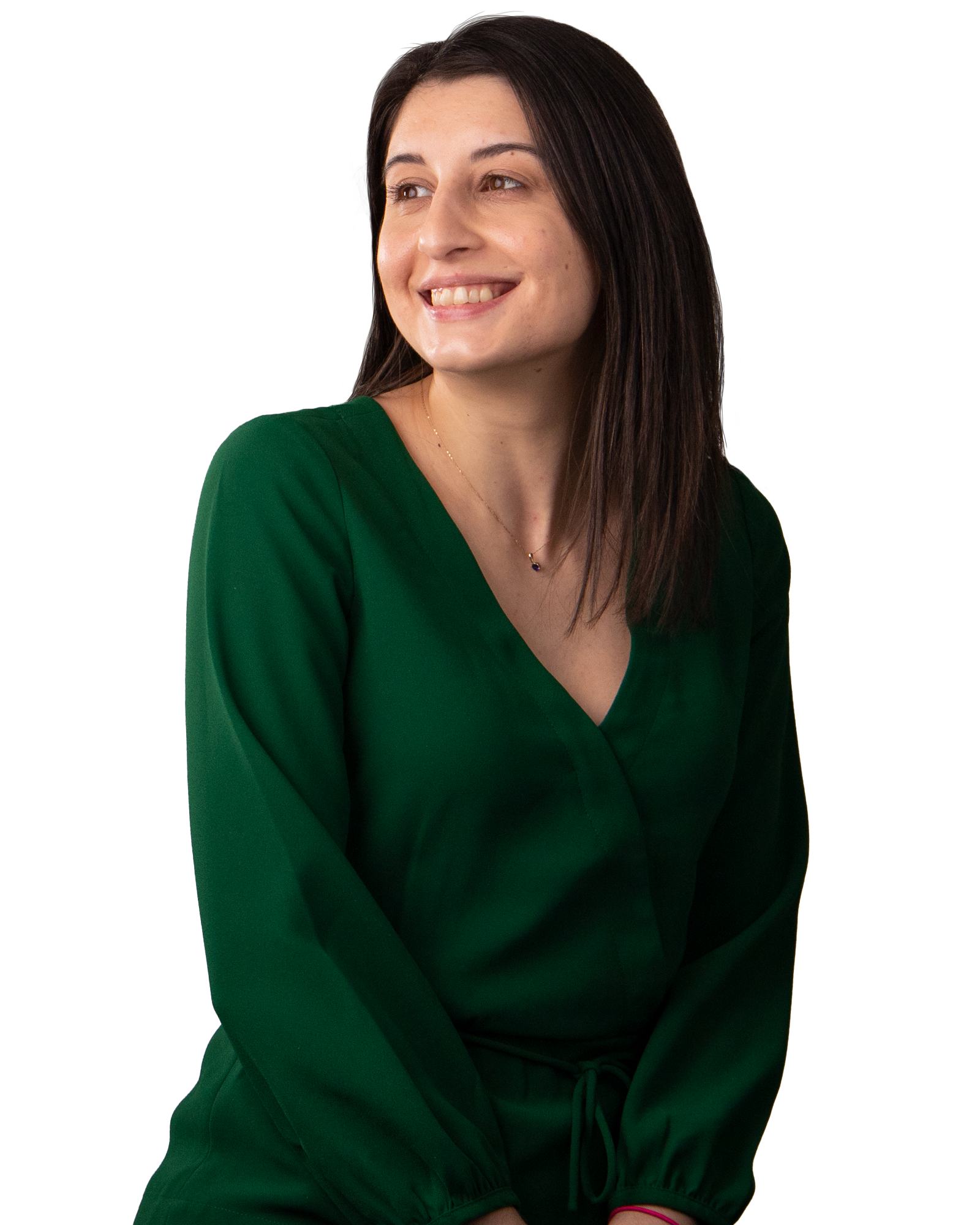 A woman smiling wearing a green jumper