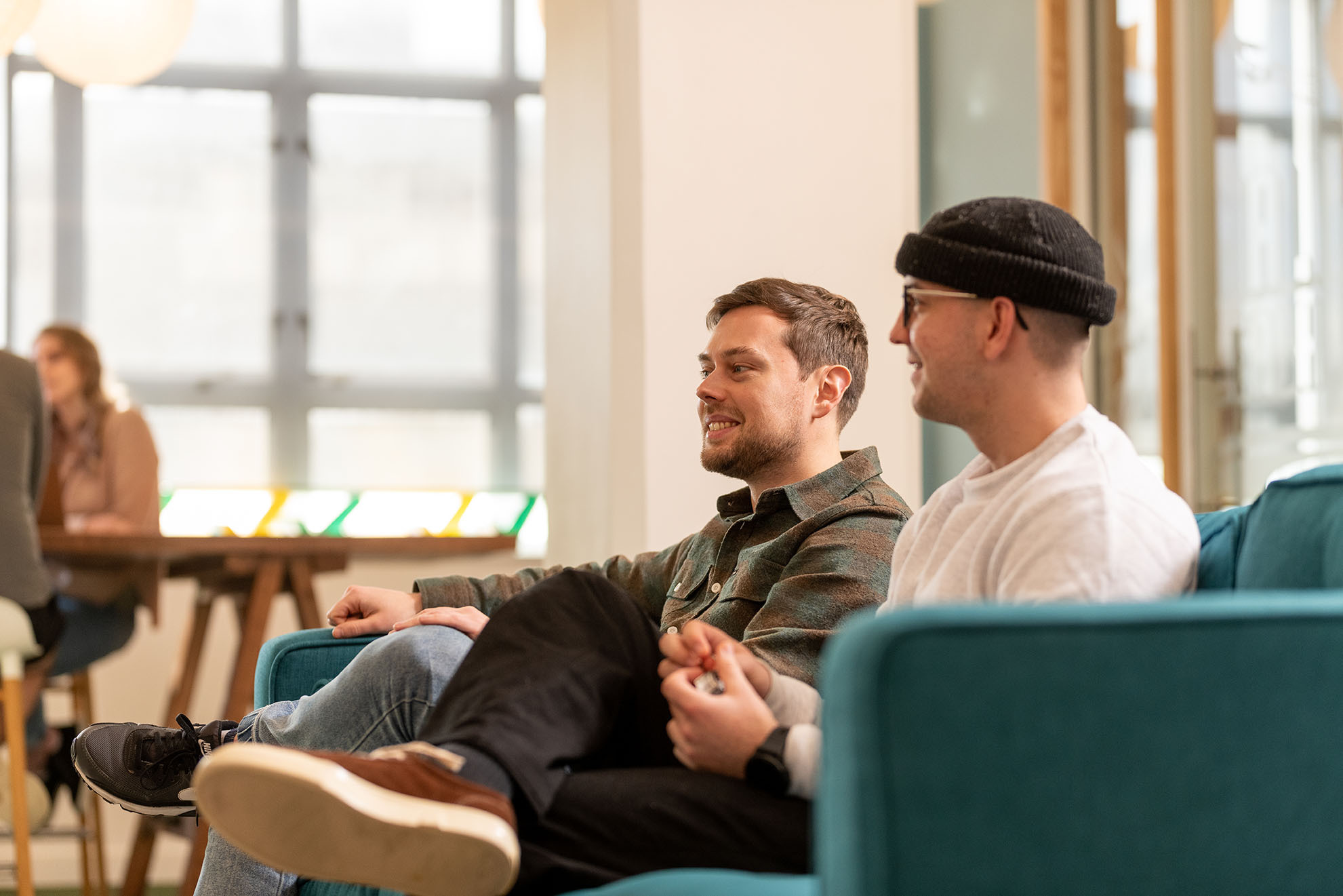 Two men sitting on a couch
