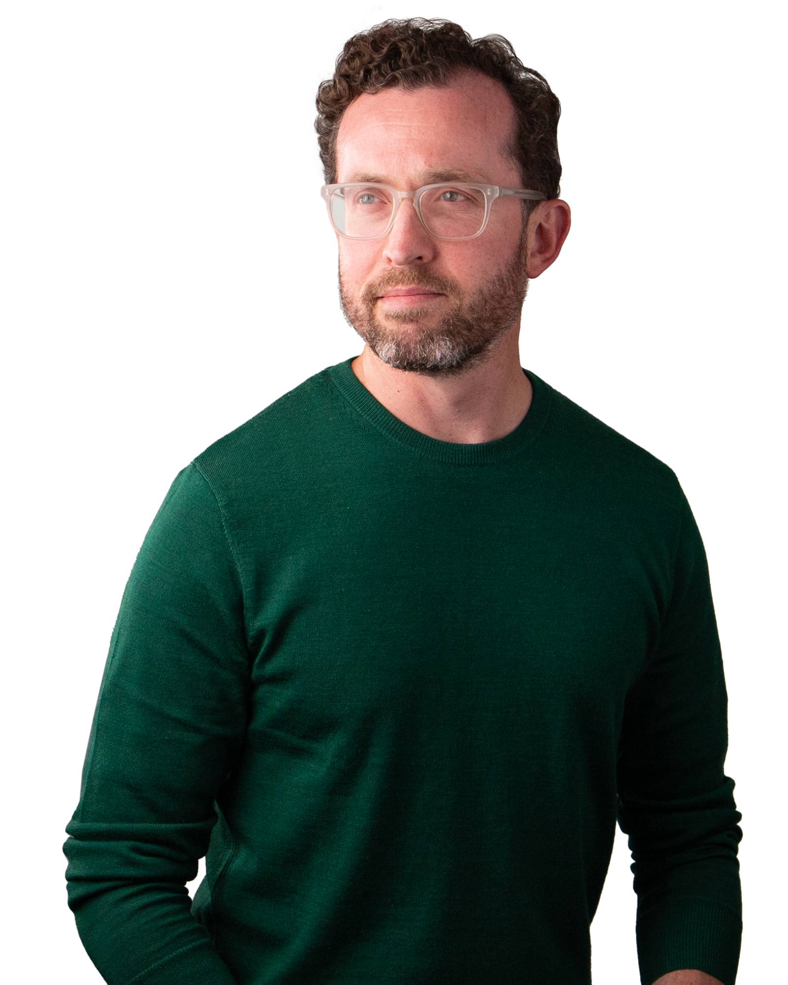 Man wearing a green jumper and clear glasses