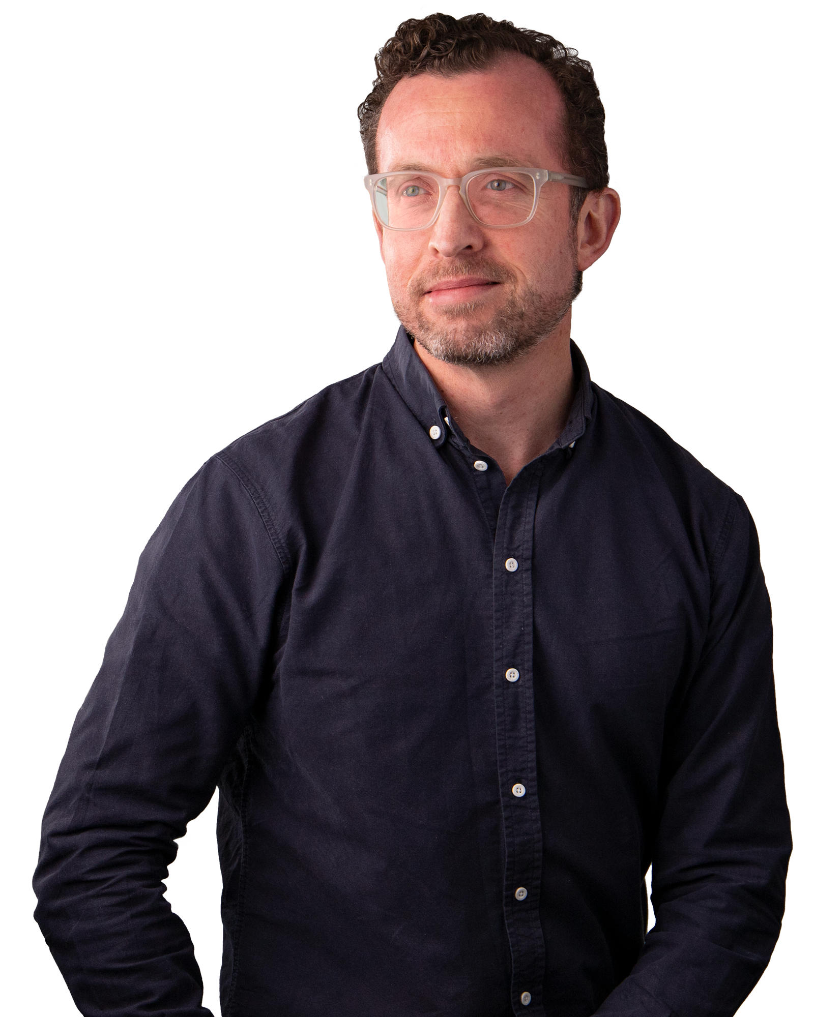 Man wearing Navy Blue button up shirt and clear glasses