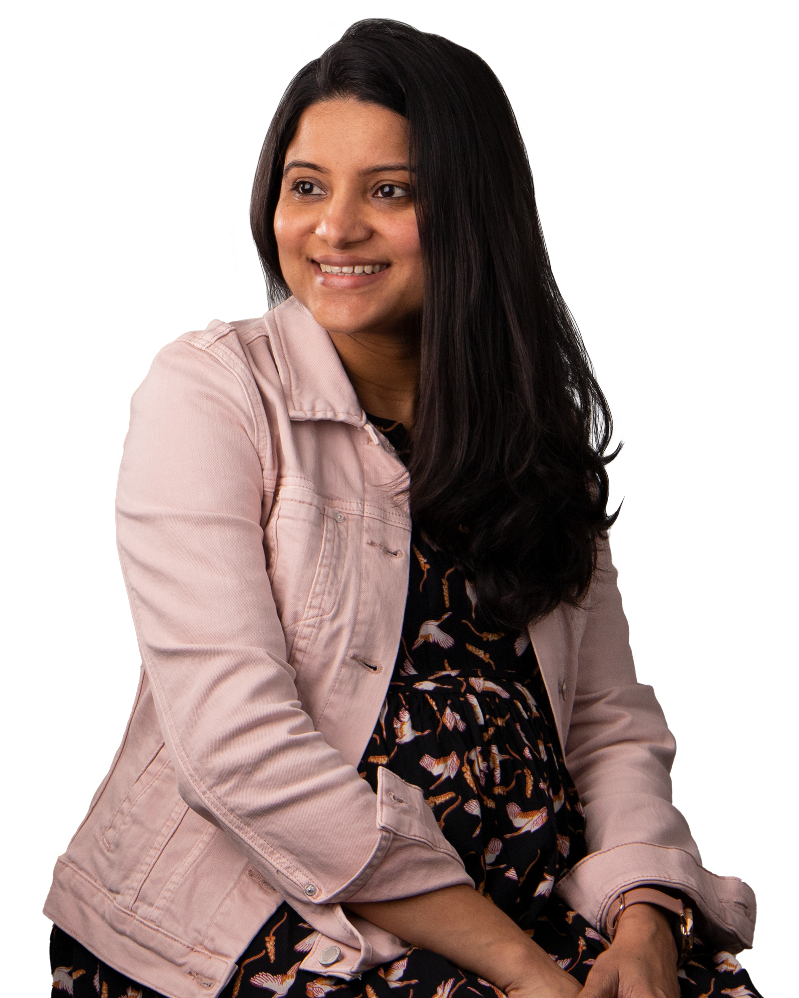 Women with long dark hair, wearing a light pink jacket, smiling.