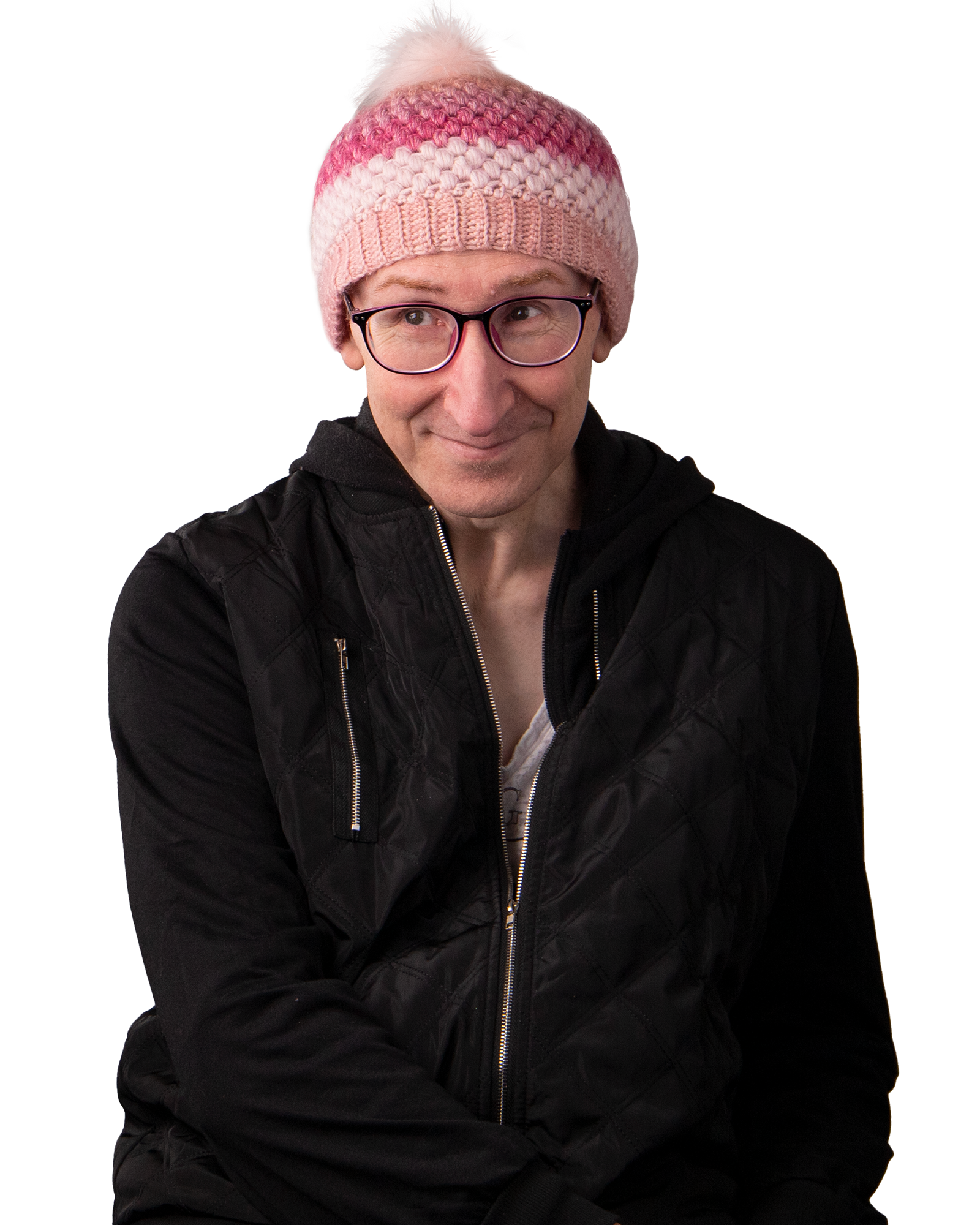 Man wearing a beanie and glasses, smiling.