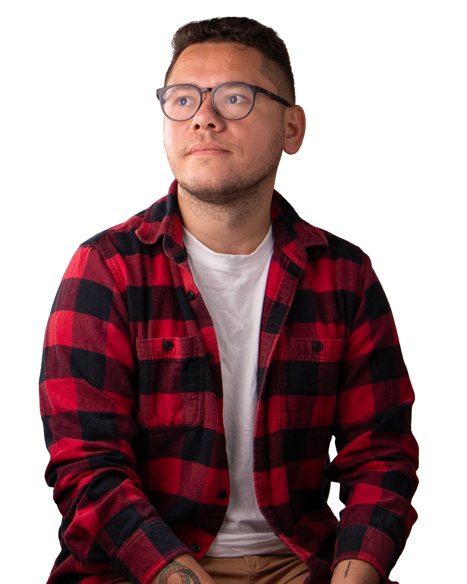 Man with short dark hair and glasses. Wearing a red checkered shirt.