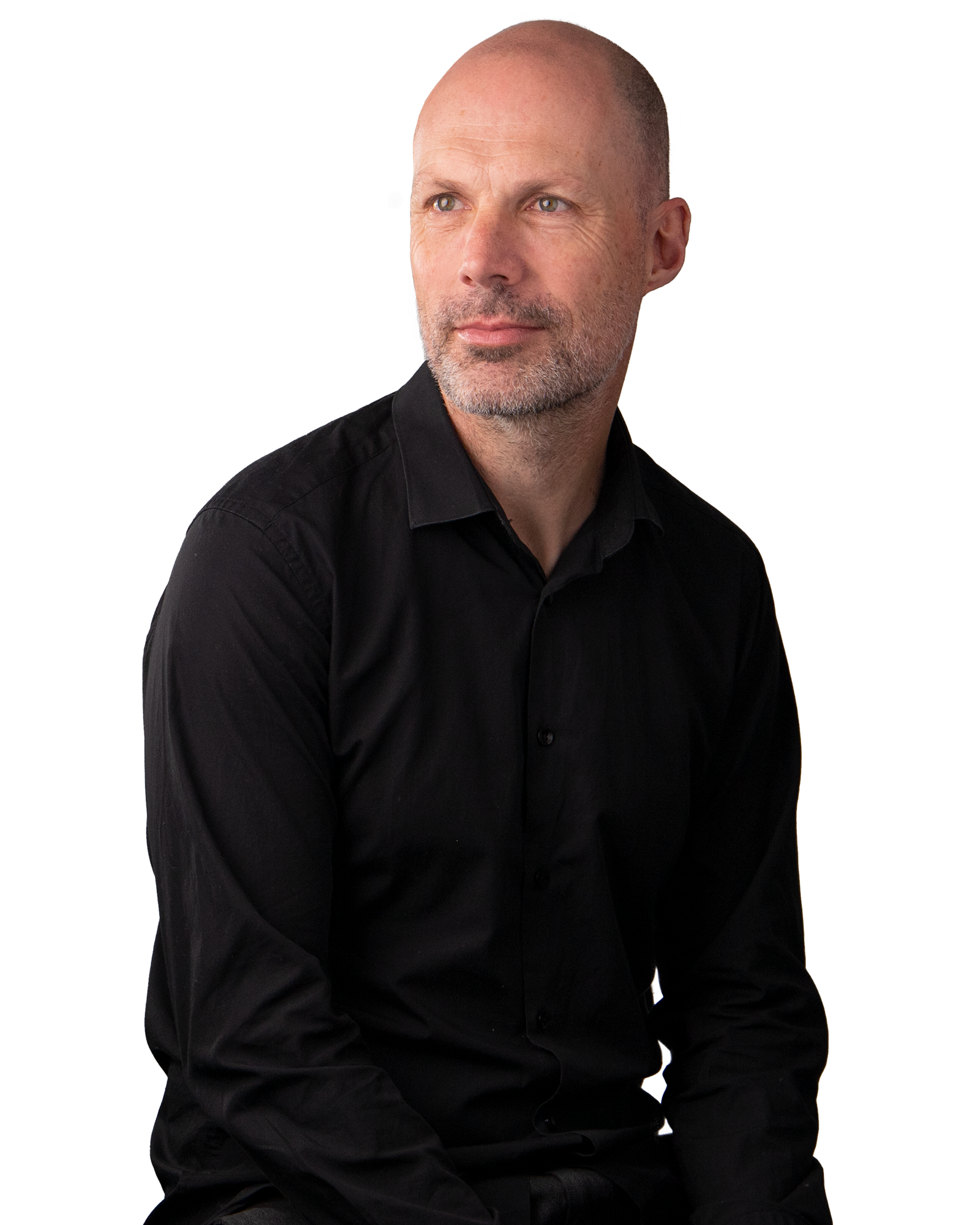 Man in Black button up shirt, smiling.