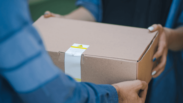 Woman delivers package to man