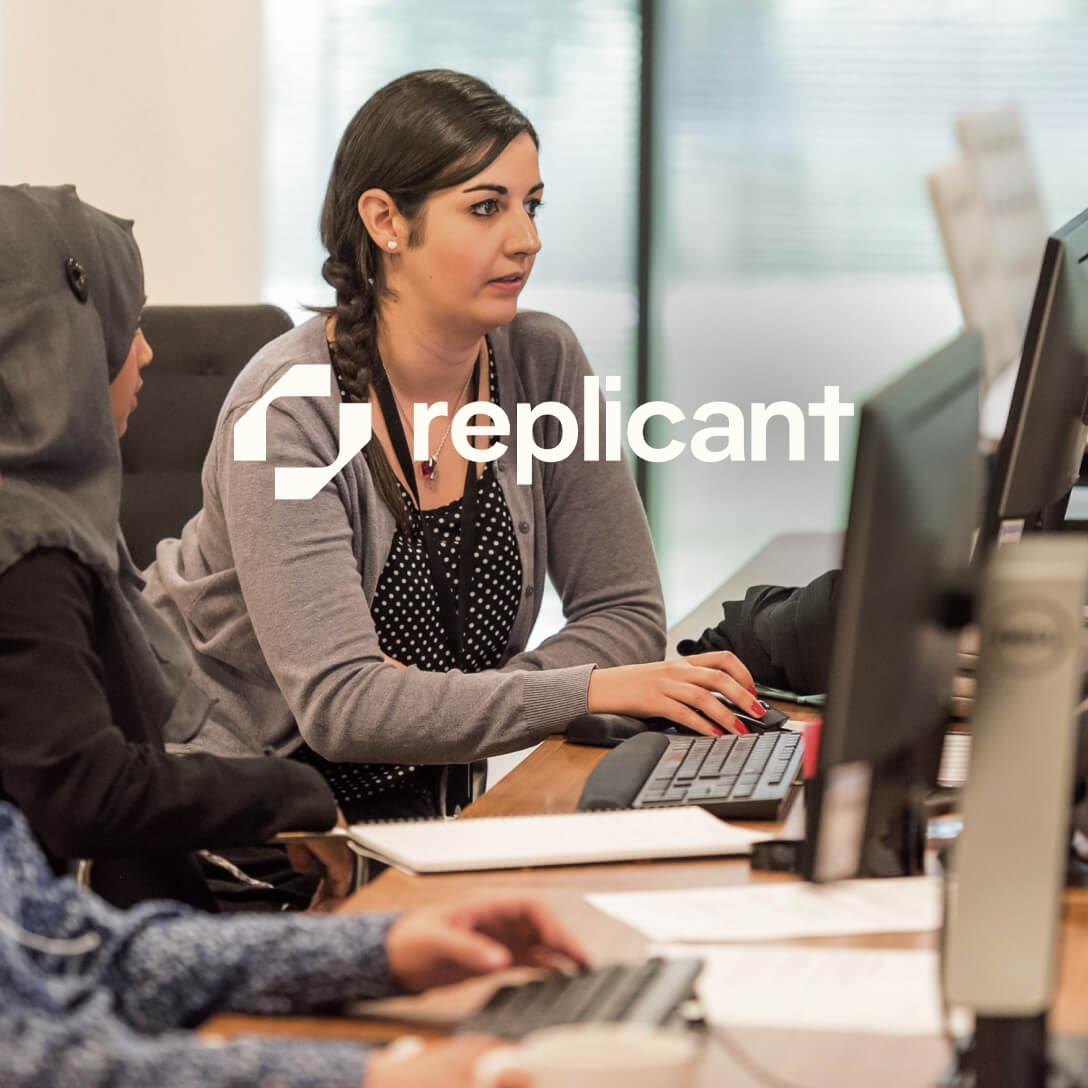 Replicant logo and lady one computer