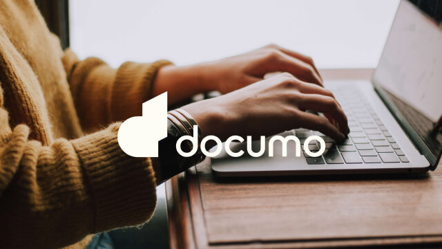 Documo logo over man on keyboard
